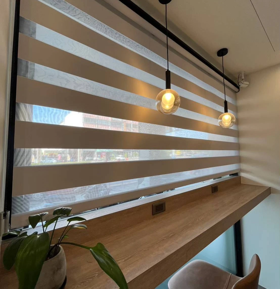 The image displays an assortment of curtain tiebacks and rods on display shelves, set against a neutral-colored background...